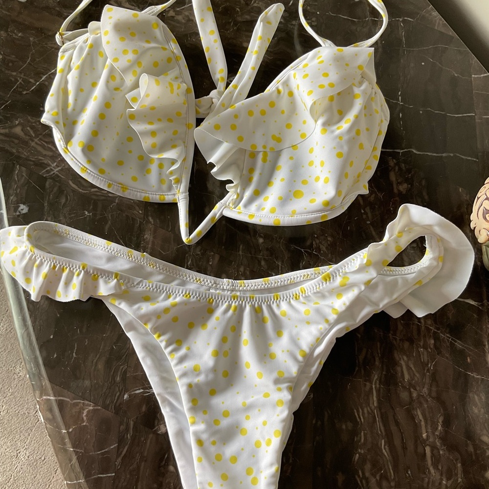 Plumeria swim bikini top is 32-34 DD, bottom L